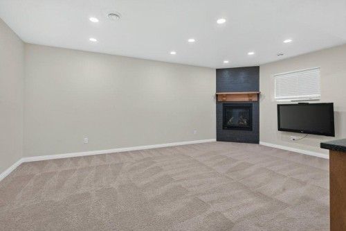 164 Aspenmere Close, Chestermere, AB - Indoor With Fireplace