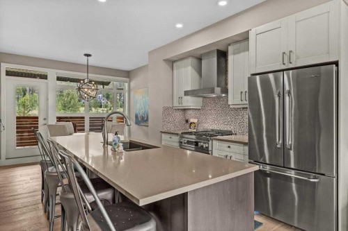 418 Riva Heights, Canmore, AB - Indoor Photo Showing Kitchen With Stainless Steel Kitchen With Double Sink With Upgraded Kitchen