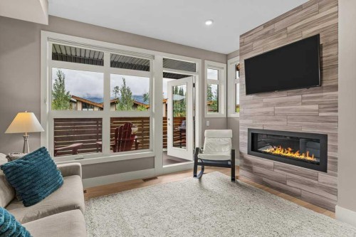 418 Riva Heights, Canmore, AB - Indoor Photo Showing Living Room With Fireplace