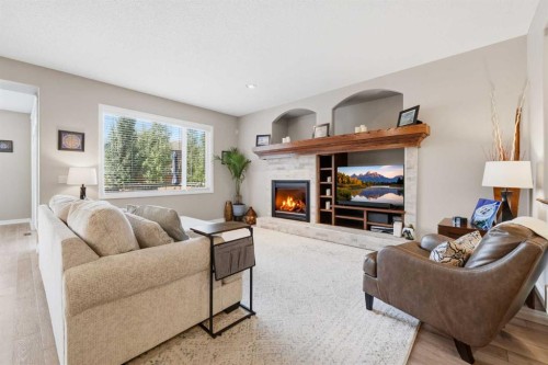 274 Autumn Circle Se, Calgary, AB - Indoor Photo Showing Living Room With Fireplace