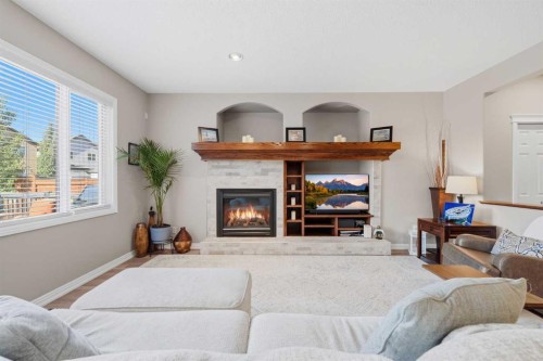 274 Autumn Circle Se, Calgary, AB - Indoor Photo Showing Living Room With Fireplace