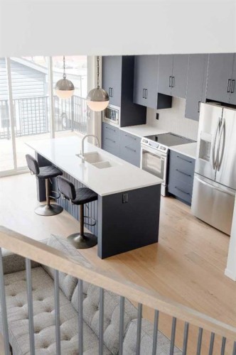 96 Fireside Common, Cochrane, AB - Indoor Photo Showing Kitchen With Stainless Steel Kitchen With Double Sink