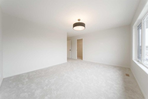 96 Fireside Common, Cochrane, AB - Indoor Photo Showing Other Room