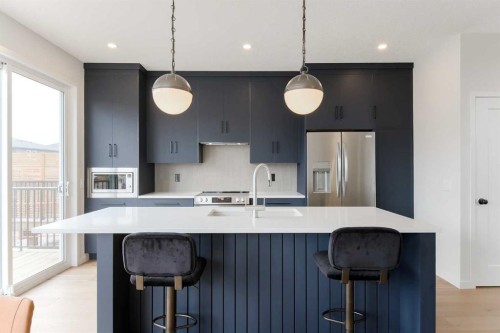 96 Fireside Common, Cochrane, AB - Indoor Photo Showing Kitchen With Upgraded Kitchen