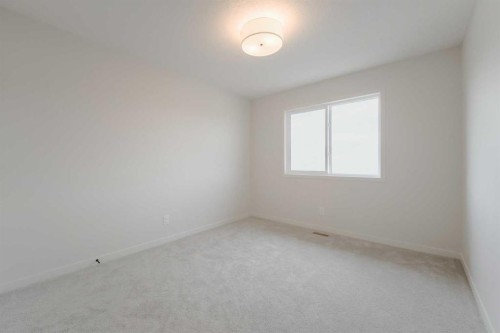 96 Fireside Common, Cochrane, AB - Indoor Photo Showing Other Room