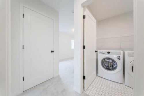 96 Fireside Common, Cochrane, AB - Indoor Photo Showing Laundry Room