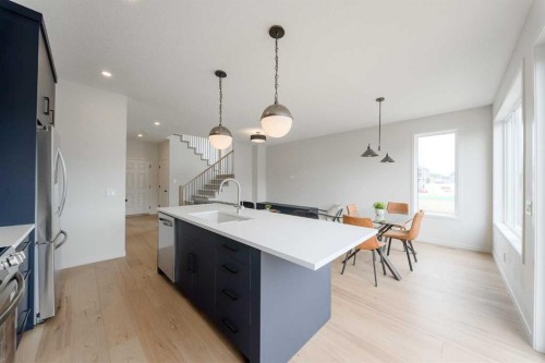 96 Fireside Common, Cochrane, AB - Indoor Photo Showing Kitchen With Upgraded Kitchen