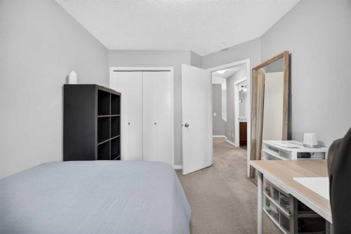 437 Tuscany Drive Nw, Calgary, AB - Indoor Photo Showing Bedroom