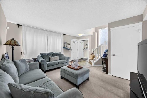 437 Tuscany Drive Nw, Calgary, AB - Indoor Photo Showing Living Room