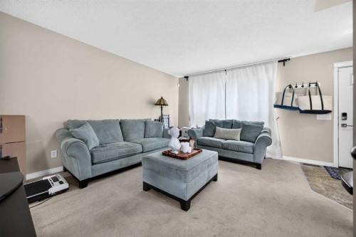 437 Tuscany Drive Nw, Calgary, AB - Indoor Photo Showing Living Room