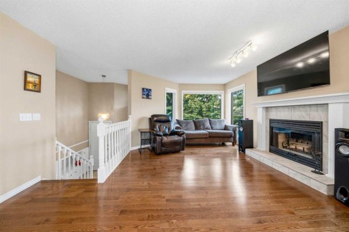 36 Shannon Circle Sw, Calgary, AB - Indoor Photo Showing Living Room With Fireplace