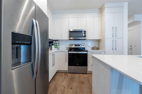 1207-681 Savanna Boulevard Ne, Calgary, AB - Indoor Photo Showing Kitchen