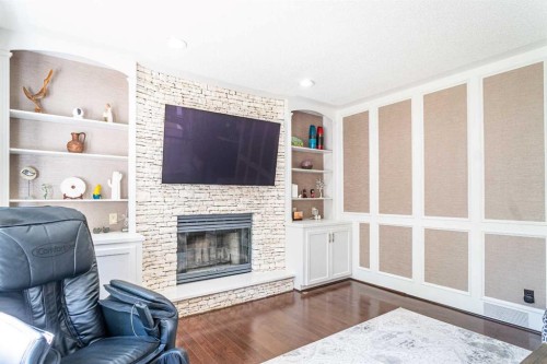 307 Woodhaven Bay Sw, Calgary, AB - Indoor Photo Showing Living Room With Fireplace