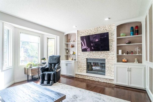 307 Woodhaven Bay Sw, Calgary, AB - Indoor Photo Showing Living Room With Fireplace