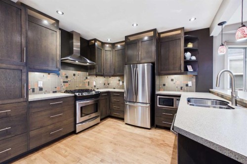 224 10A Street Nw, Calgary, AB - Indoor Photo Showing Kitchen With Stainless Steel Kitchen With Double Sink With Upgraded Kitchen