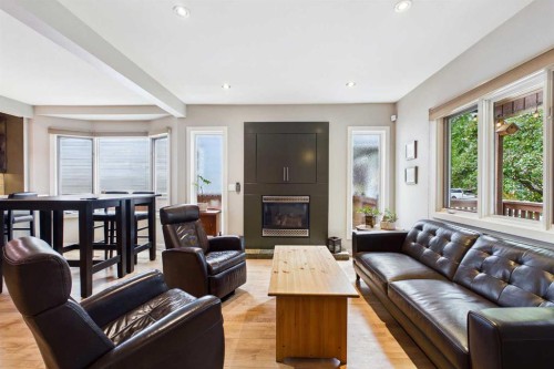 224 10A Street Nw, Calgary, AB - Indoor Photo Showing Living Room With Fireplace