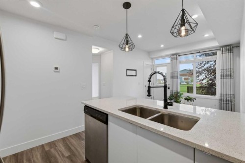 214 Seton Passage Se, Calgary, AB - Indoor Photo Showing Kitchen With Double Sink