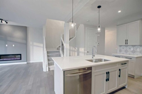 12 Topaz Place, Cochrane, AB - Indoor Photo Showing Kitchen With Double Sink With Upgraded Kitchen