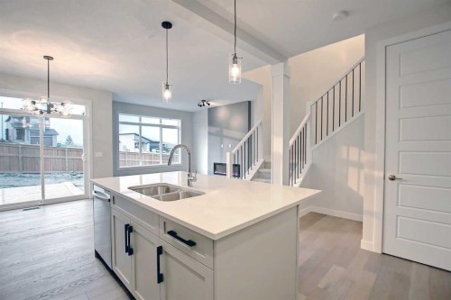 12 Topaz Place, Cochrane, AB - Indoor Photo Showing Kitchen With Double Sink