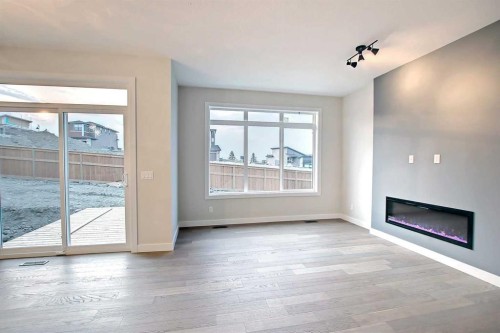 12 Topaz Place, Cochrane, AB - Indoor Photo Showing Other Room With Fireplace