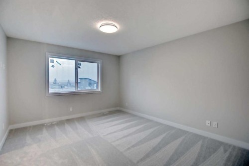 12 Topaz Place, Cochrane, AB - Indoor Photo Showing Other Room