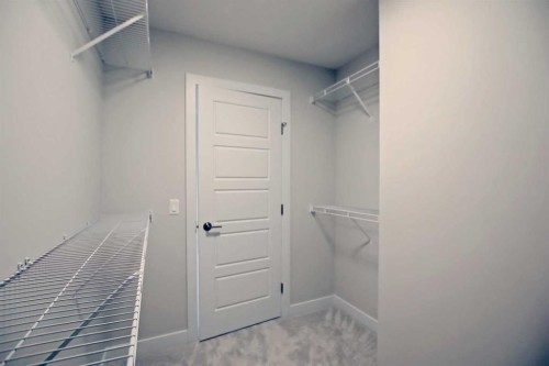 12 Topaz Place, Cochrane, AB - Indoor With Storage