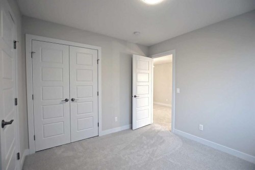 12 Topaz Place, Cochrane, AB - Indoor Photo Showing Other Room