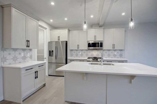12 Topaz Place, Cochrane, AB - Indoor Photo Showing Kitchen With Upgraded Kitchen