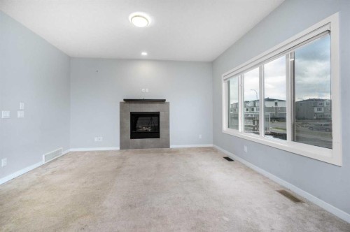101 Savanna Close Ne, Calgary, AB - Indoor Photo Showing Living Room With Fireplace