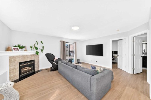 315 Appleglen Place Se, Calgary, AB - Indoor Photo Showing Living Room With Fireplace