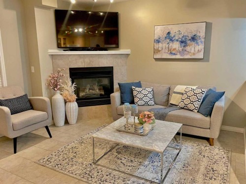 66 Chaparral Ridge Terrace Se, Calgary, AB - Indoor Photo Showing Living Room With Fireplace