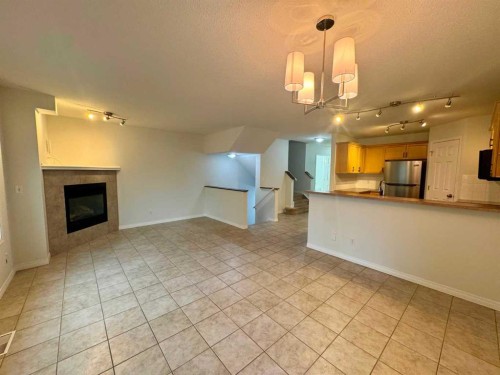 66 Chaparral Ridge Terrace Se, Calgary, AB - Indoor Photo Showing Other Room With Fireplace