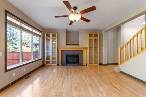49 Panamount Rise Nw, Calgary, AB - Indoor Photo Showing Living Room With Fireplace