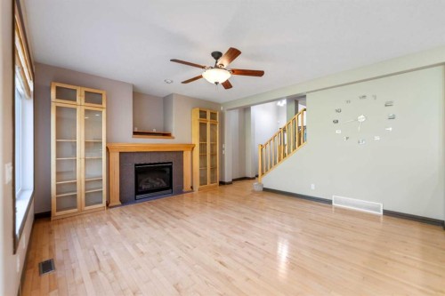 49 Panamount Rise Nw, Calgary, AB - Indoor Photo Showing Living Room With Fireplace
