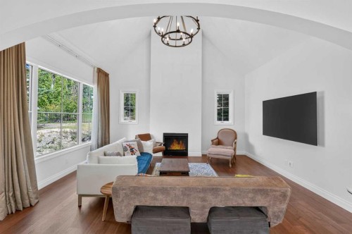 8 Spring Valley Lane Sw, Calgary, AB - Indoor Photo Showing Living Room With Fireplace