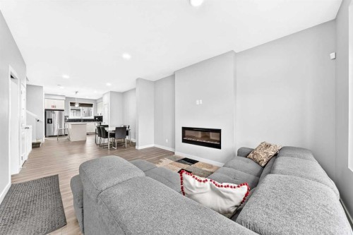 164 Langwell Common Se, Airdrie, AB - Indoor Photo Showing Living Room With Fireplace