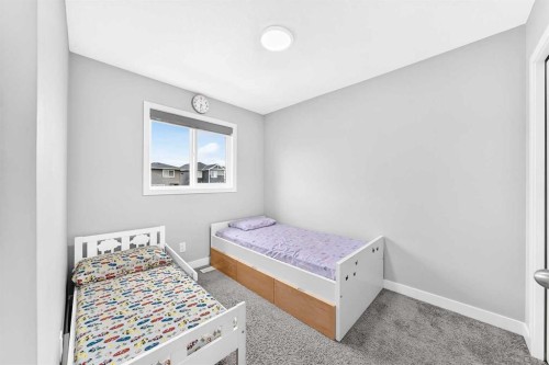 164 Langwell Common Se, Airdrie, AB - Indoor Photo Showing Bedroom