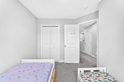 164 Langwell Common Se, Airdrie, AB - Indoor Photo Showing Bedroom