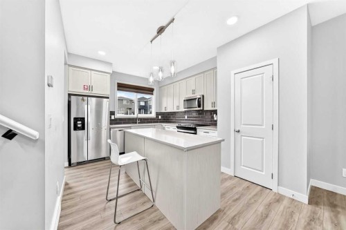 164 Langwell Common Se, Airdrie, AB - Indoor Photo Showing Kitchen With Stainless Steel Kitchen With Upgraded Kitchen
