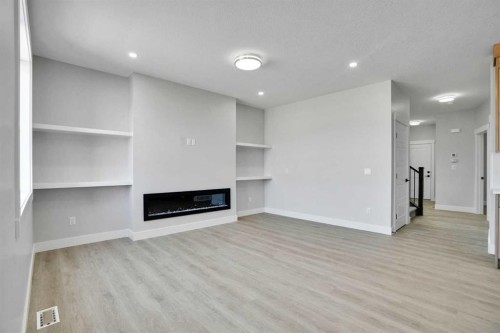 534 Ranch Green, Strathmore, AB - Indoor With Fireplace