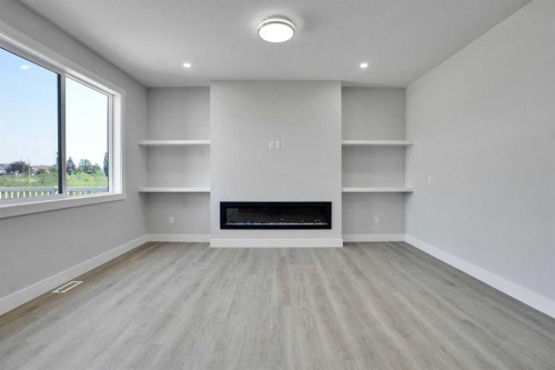 534 Ranch Green, Strathmore, AB - Indoor With Fireplace