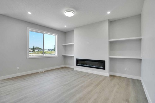 534 Ranch Green, Strathmore, AB - Indoor With Fireplace
