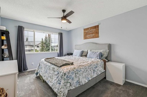 116 Quigley Close, Cochrane, AB - Indoor Photo Showing Bedroom