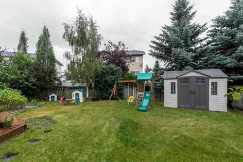 116 Quigley Close, Cochrane, AB - Outdoor With Backyard