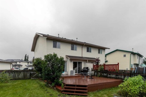 116 Quigley Close, Cochrane, AB - Outdoor With Deck Patio Veranda With Exterior