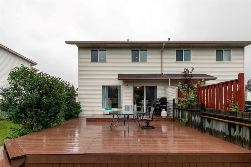 116 Quigley Close, Cochrane, AB - Outdoor With Deck Patio Veranda With Exterior
