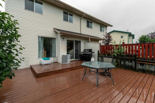 116 Quigley Close, Cochrane, AB - Outdoor With Deck Patio Veranda With Exterior
