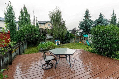 116 Quigley Close, Cochrane, AB - Outdoor With Deck Patio Veranda With Backyard