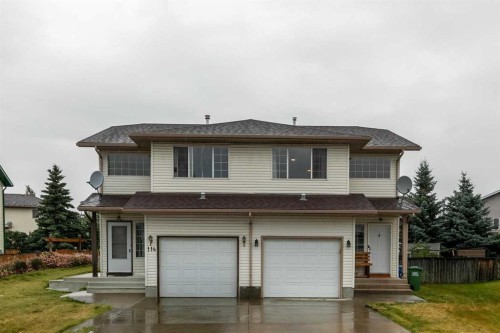 116 Quigley Close, Cochrane, AB - Outdoor With Facade