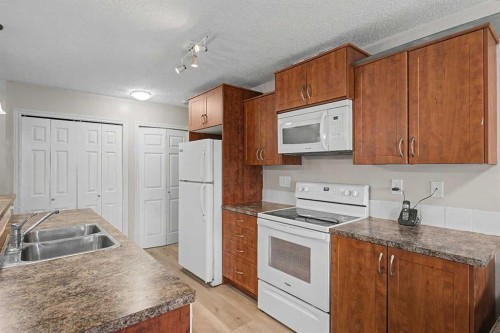 2430-700 Willowbrook Road Nw, Airdrie, AB - Indoor Photo Showing Kitchen With Double Sink